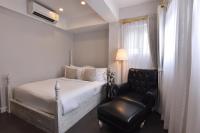 Ein Bett oder Betten in einem Zimmer der Unterkunft Noursabah Boutique Bed Bangkok
