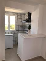 A kitchen or kitchenette at Apartamentos Vista Vedrá