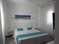 A bed or beds in a room at Apartamentos Vista Vedrá