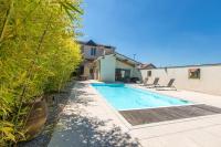 a swimming pool in the backyard of a house at Othil in Aire-sur-lʼAdour