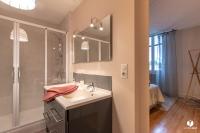 a bathroom with a sink and a shower at Othil in Aire-sur-lʼAdour