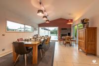 a dining room with a long table and chairs at Othil in Aire-sur-lʼAdour