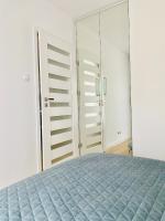 Posteľ alebo postele v izbe v ubytovaní Apart111 Apartamenty - Garden