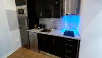 A kitchen or kitchenette at APARTAMENTOS EL POZO AMARGO