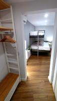 A bed or beds in a room at APARTAMENTOS EL POZO AMARGO