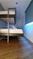 A bed or beds in a room at APARTAMENTOS EL POZO AMARGO