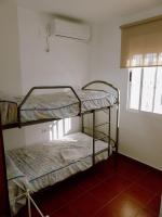 Postel nebo postele na pokoji v ubytování Faro II Holiday Home