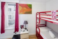 a bedroom with a bunk bed and a desk at Astor Hyde Park Hostel in London