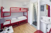a bathroom with two bunk beds and a sink at Astor Hyde Park Hostel in London