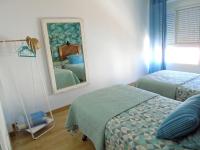 Postel nebo postele na pokoji v ubytování Lindo y acogedor Apartamento Grao Playa Gandia piso 5to sin ascensor