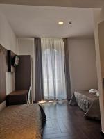 Posteľ alebo postele v izbe v ubytovaní Rome Travellers Hotel