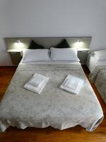 Posteľ alebo postele v izbe v ubytovaní Apartment Nido Stazione