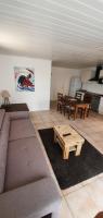 a living room with a couch and a coffee table at Bel appartement dans hameau calme in Bonifacio