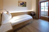 Posteľ alebo postele v izbe v ubytovaní Gästehaus Brantlhof Zimmer und Ferienwohnungen in Going am Wilden Kaiser