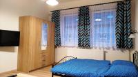 Postel nebo postele na pokoji v ubytování Apartmány Kukaččí hnízdo