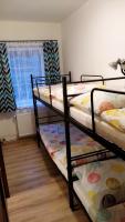Postel nebo postele na pokoji v ubytování Apartmány Kukaččí hnízdo