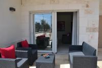 Posedenie v ubytovaní Alba Apartment - Villaggio di Mary
