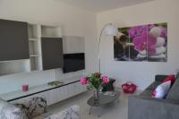 Televízia a/alebo spoločenská miestnosť v ubytovaní Alba Apartment - Villaggio di Mary