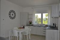 Kuchyňa alebo kuchynka v ubytovaní Alba Apartment - Villaggio di Mary