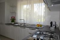 Kuchyňa alebo kuchynka v ubytovaní Alba Apartment - Villaggio di Mary