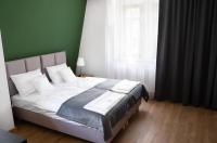 Postel nebo postele na pokoji v ubytování Apartamenty, Boutique Rooms Villa 82, MIEJSCE PRKINGOWE