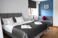 Postel nebo postele na pokoji v ubytování Apartamenty, Boutique Rooms Villa 82, MIEJSCE PRKINGOWE