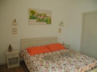 A bed or beds in a room at B&B Mimosa e Lillà