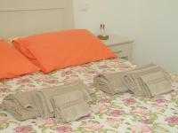 A bed or beds in a room at B&B Mimosa e Lillà