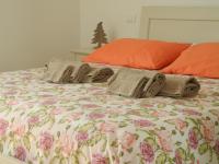 A bed or beds in a room at B&B Mimosa e Lillà