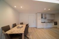 A kitchen or kitchenette at Blue Moon - Via Parigi Apartments