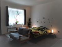 Postel nebo postele na pokoji v ubytování Apartmány Karlštejn