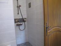 a bathroom with a shower with a shower head at L&#39;Oustau de Bigatié in Lambesc
