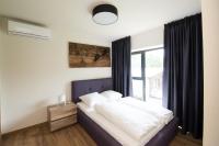 Posteľ alebo postele v izbe v ubytovaní Apartamenty Minimal House