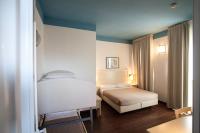 Posteľ alebo postele v izbe v ubytovaní Hotel Fra I Pini