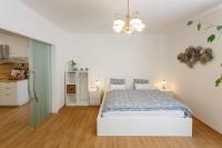Łóżko lub łóżka w pokoju w obiekcie Apartments Villa Whitehouse