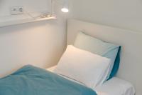 Łóżko lub łóżka w pokoju w obiekcie Apartments Villa Whitehouse