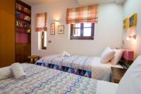 Posteľ alebo postele v izbe v ubytovaní La Casa di Pietra Villas