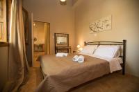 Posteľ alebo postele v izbe v ubytovaní Kamaraki-Apartments