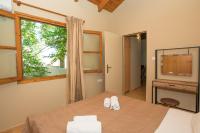 Posteľ alebo postele v izbe v ubytovaní Kamaraki-Apartments
