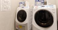a washing machine and a dryer in a room at HOTEL SUI AKASAKA by ABEST in Tokyo
