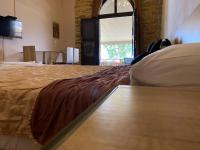Postel nebo postele na pokoji v ubytování Apanemia Rooms