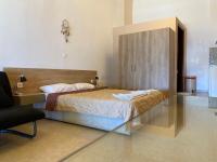 Postel nebo postele na pokoji v ubytování Apanemia Rooms