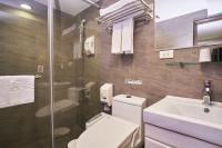 a bathroom with a toilet and a sink and a shower at 意芙旅店 Ifinn Hotel in Taipei