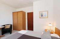 Posteľ alebo postele v izbe v ubytovaní Murter Pod Raduč apartman