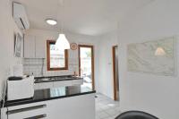 Kuchyňa alebo kuchynka v ubytovaní Murter Pod Raduč apartman