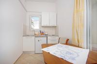 Kuchyň nebo kuchyňský kout v ubytování Apartmani Srzic