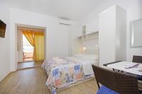 Postel nebo postele na pokoji v ubytování Apartmani Srzic
