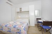 Postel nebo postele na pokoji v ubytování Apartmani Srzic