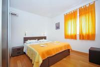 Postel nebo postele na pokoji v ubytování Apartmani Srzic