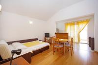 Postel nebo postele na pokoji v ubytování Apartmani Srzic